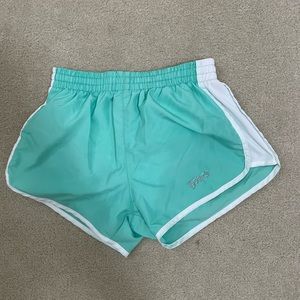 Green Tyler’s running shorts